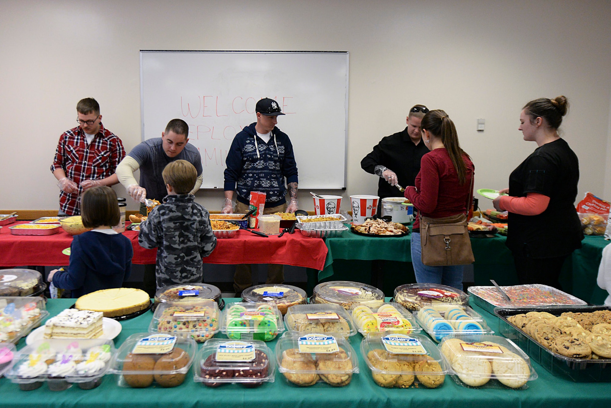 Airman Leadership School students serve meals to family members March 23 at the Hill Air Force Base chapel. The dinner was designed to provide a stress-free evening for family members whose Airmen spouses and parents are currently deployed. (U.S. Air Force photo by Paul Holcomb)