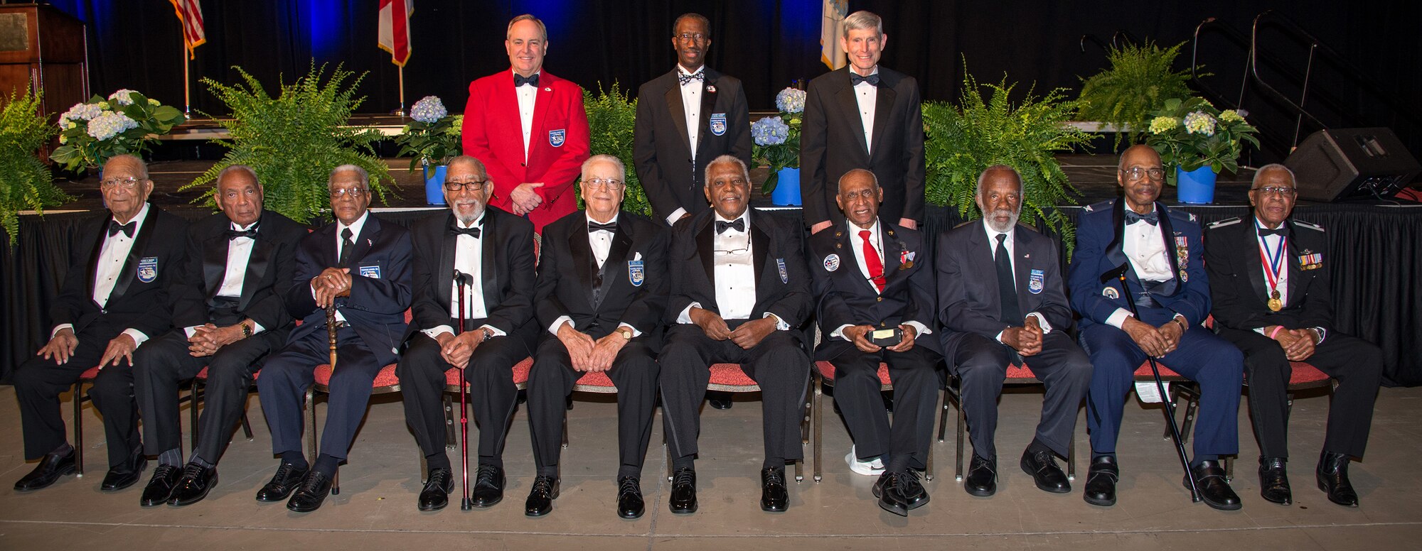 From left to right, standing, Chief of Staff of the Air Force Gen. Mark A. Welsh III, retired Brig. Gen. Leon Johnson and former Chief of Staff of the Air Force Gen. Norton A Schwartz, stand behind 10 original Tuskegee Airmen during the Tuskegee Airmen Foundation 75th Anniversary commemoration in Montgomery, Alabama, March 22, 2016.
Welsh was inducted as an honorary Tuskegee Airman during the event. Schwartz is also an inductee. Johnson is Board Chair Tuskegee Airman Foundation and National President, CEO and Board Chair Tuskegee Airmen, Inc. (US Air Force photo by Trey Ward)