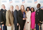 U.S. Army Reserve 1st Lt. Jessica Purcell (center) receives local area news station Bay News 9’s “2015 Hero of the Year” award during a ceremony. Purcell played a key role in the rescue of a 43-year-old Bradenton resident last year. (Photo courtesy of Bay News 9)