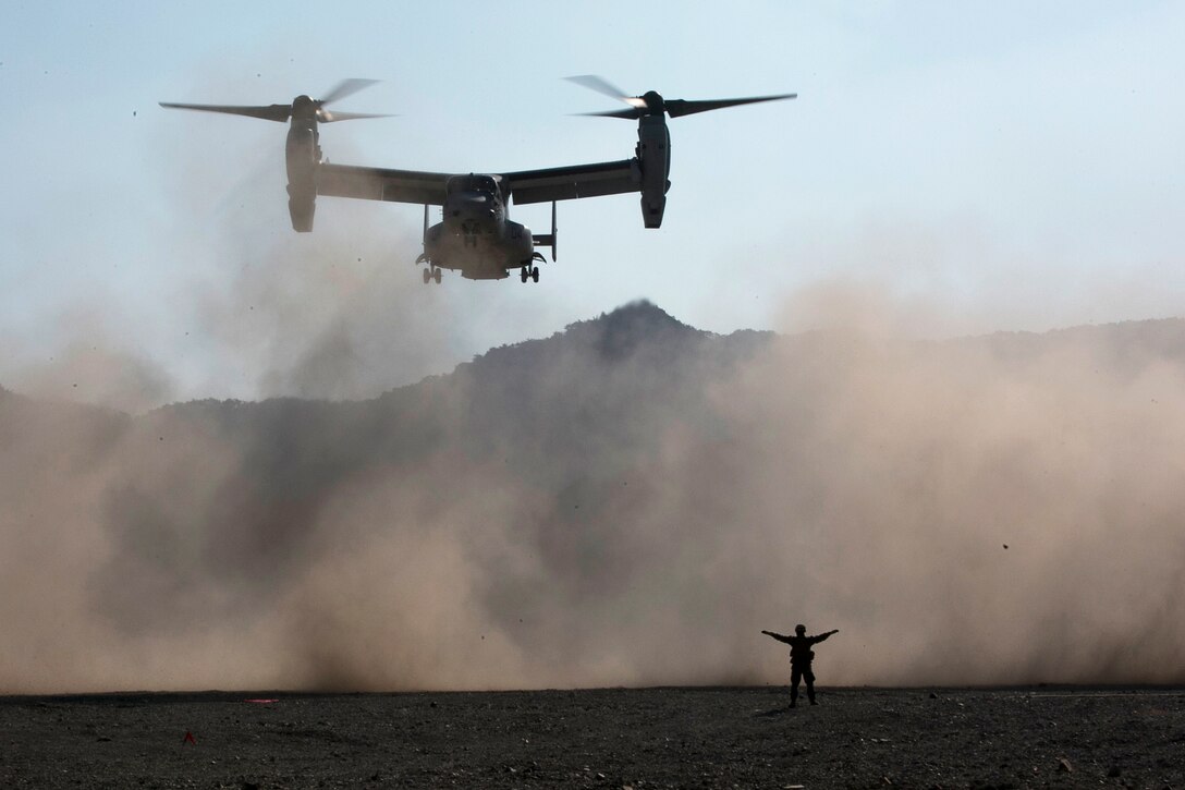 A Marine guides a Marine Corps MV-22 Osprey as it delivers ammunition during Exercise Ssang Yong 2016 in Pohang, South Korea, March 11, 2016. Marine Corps photo by Sgt. Briauna Birl