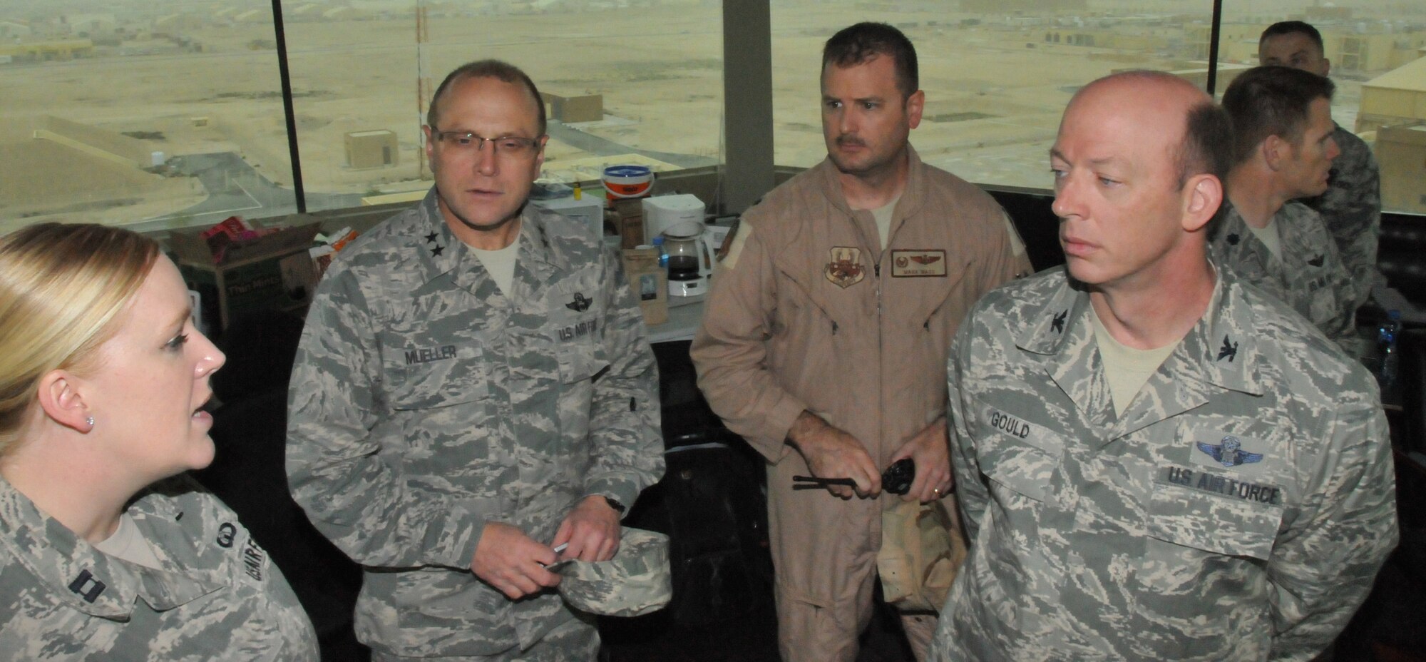 Maj. Gen. Andrew Mueller, Air Force Chief of Safety, visits air traffic control tower members at Al Udeid Air Base, Qatar March 16. Muller listened as the Airmen described their mission and any safety concerns while deployed here. (U.S. Air Force photo by Tech. Sgt. Terrica Y. Jones/Released