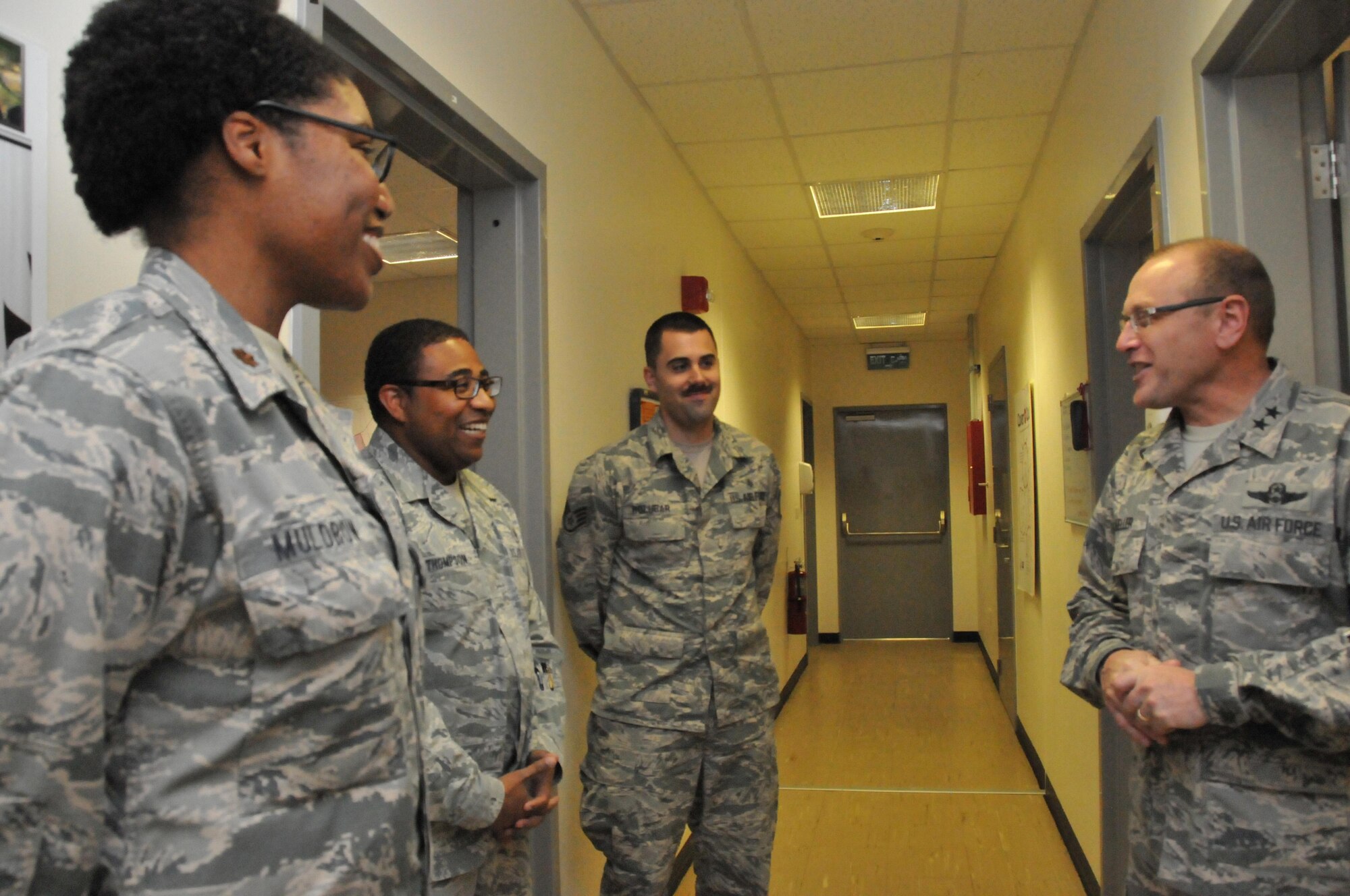 Maj. Gen. Andrew Mueller (right), Air Force Chief of Safety talks to members of the 379th Expeditionary Medical Group public health team, March 16 at Al Udeid Air Base, Qatar. Mueller coined three members of the public health team who won the 379th Air Expeditionary Wing’s Occupational Safety Award in February. (U.S. Air Force photo by Tech. Sgt. Terrica Y. Jones/Released)