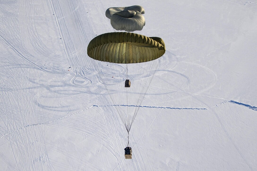 An Air Force C-17 Globemaster III aircraft drops an arctic sustainment package over Ice Camp Sargo to support Ice Exercise 2016 in the Arctic Circle, March 15, 2016. Air Force photo by Senior Airman James Richardson