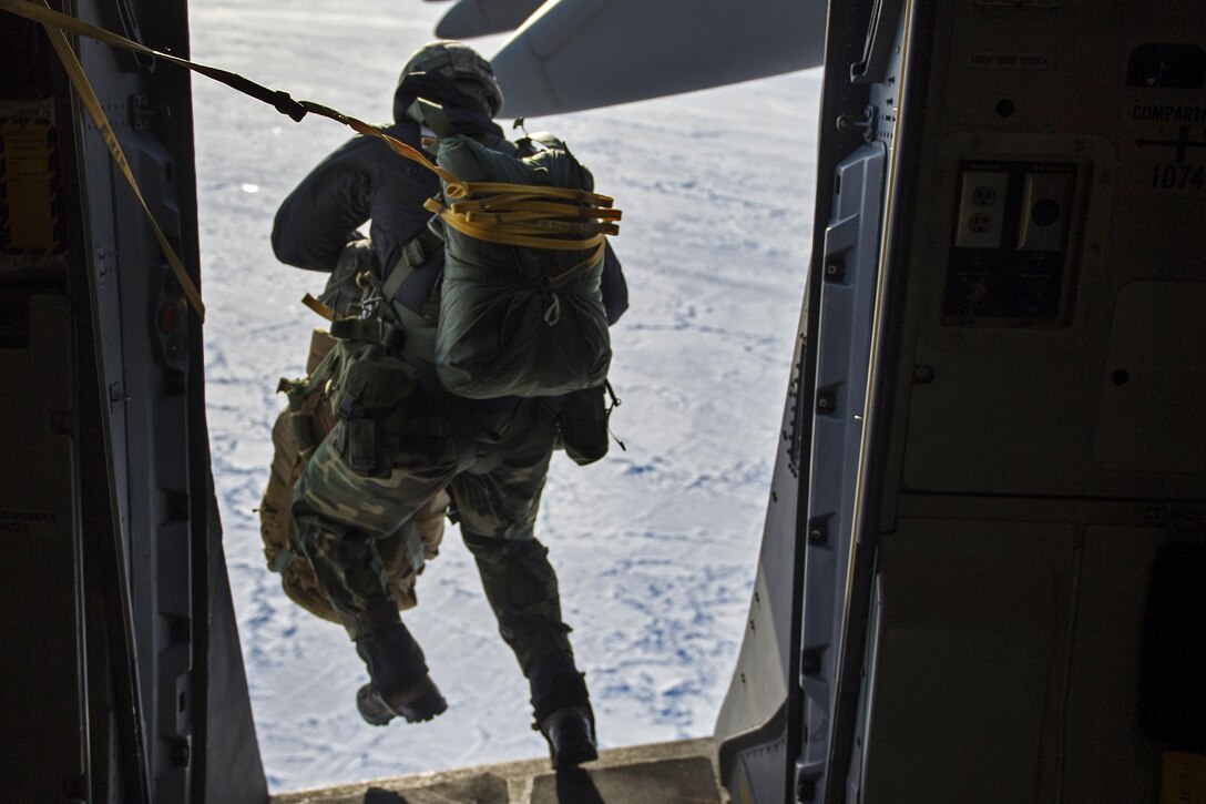 An Air Force airman jumps out of a C-17 Globemaster III aircraft over Ice Camp Sargo to support Ice Exercise 2016 in the Arctic Circle, March 15, 2016. Air Force photo by Senior Airman James Richardson