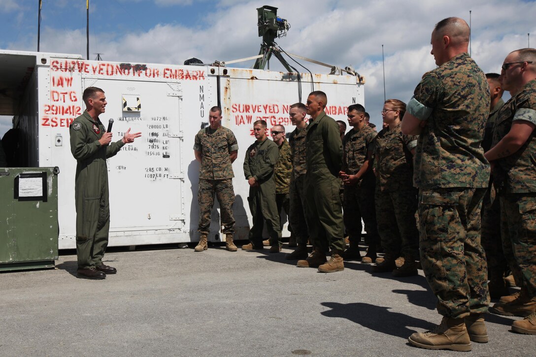 Lt. Col. Kris Faught speaks to Marines with Marine Unmanned Aerial Vehicle Squadron 2 before the first RQ-21A Blackjack flight into Class D airspace over Marine Corps Air Station Cherry Point, N.C., March 21, 2016. The RQ-21A Blackjack system is modular, flexible and multi-mission capable, providing roll-on, roll-off transitions between land and maritime environments. Faught is the commanding officer of VMU-2. (U.S. Marine Corps photo by Pfc. Nicholas P. Baird/Released)