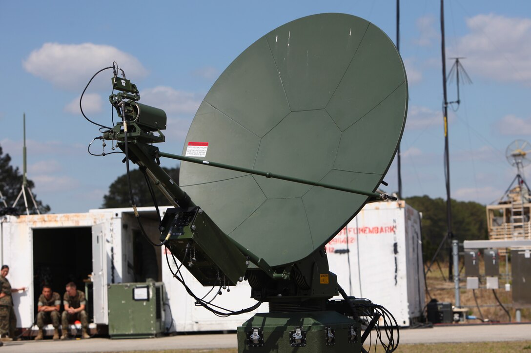 A very-small-aperture terminal medium communications system is positioned to assist Marines with Marine Unmanned Aerial Vehicle Squadron 2 in the communications with air traffic control during the first RQ-21A Blackjack flight into Class D airspace over Marine Corps Air Station Cherry Point, N.C., March 21, 2016. The RQ-21A Blackjack system is modular, flexible and multi-mission capable, providing roll-on, roll-off transitions between land and maritime environments. (U.S. Marine Corps photo by Pfc. Nicholas P. Baird/Released)