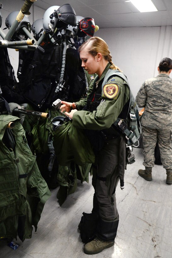 Air Force 1st Lt. Brittany Trimble dresses for flight at Korat Royal Thai Air Force Base, Thailand, March 15, 2016. Air Force photo by Staff Sgt. Amber E. Jacobs