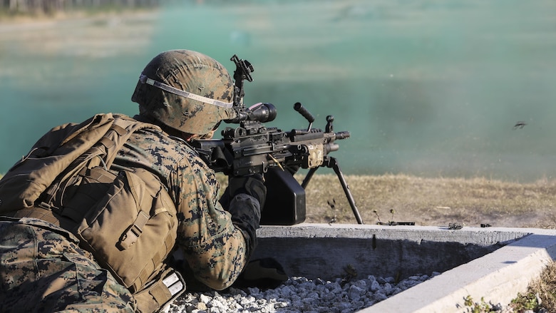 A Marine with 2nd Combat Engineer Battalion engages targets with an M249 squad automatic weapon during the machine gun range portion of the battalion’s sapper squad competition at Marine Corps Base Camp Lejeune, North Carolina, March 23, 2016. During this event, squads worked together to engage targets at ranges up to 800 meters.