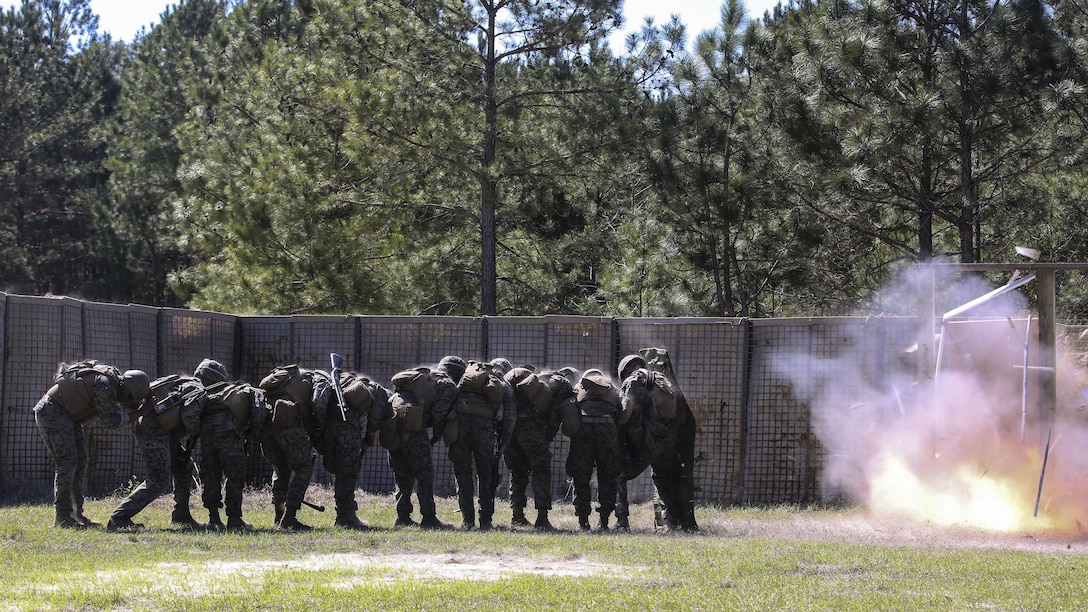 Marines with 2nd Combat Engineer Battalion breach a door during the assault breaching portion of the battalion’s sapper squad competition at Marine Corps Base Camp Lejeune, North Carolina, March 22, 2016. The competition was organized to determine the most proficient squads in the battalion while simultaneously challenging squads in the execution of combat engineer-based tasks.