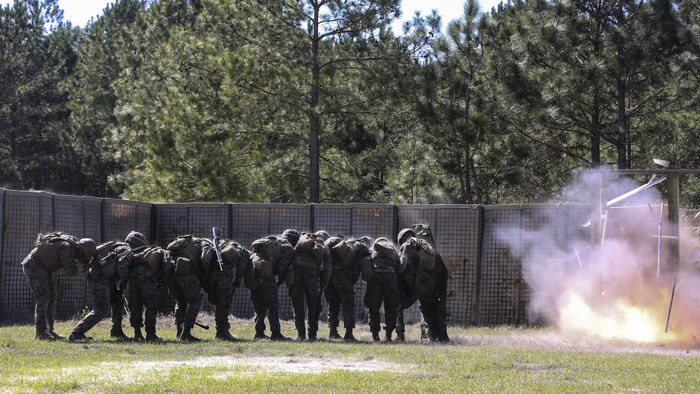 Marines with 2nd Combat Engineer Battalion breach a door during the assault breaching portion of the battalion’s sapper squad competition at Marine Corps Base Camp Lejeune, North Carolina, March 22, 2016. The competition was organized to determine the most proficient squads in the battalion while simultaneously challenging squads in the execution of combat engineer-based tasks.