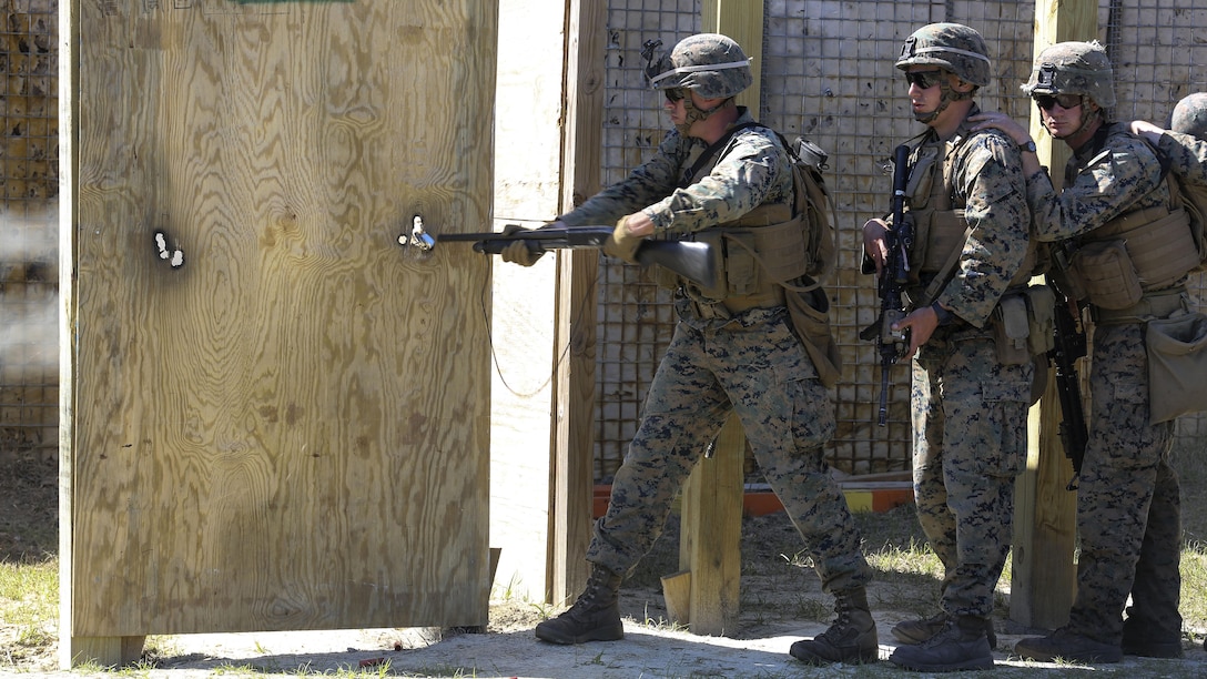 A Marine with 2nd Combat Engineer Battalion breaches a door with a Mossberg 500 shotgun during the assault breaching portion of the battalion’s sapper squad competition at Marine Corps Base Camp Lejeune, North Carolina, March 22, 2016. The competition was organized to determine the most proficient squads in the battalion while simultaneously challenging squads in the execution of combat engineer-based tasks.