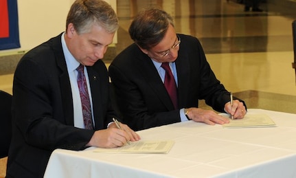 Left to Right: Assistant Chief of the Army Reserve Stephen Austin and American Corporate Partners Founder and Chair Sidney Goodfriend sign partnership documents launching the ACP Women's Veteran Mentoring Program. The event took place at the Pentagon March 21.