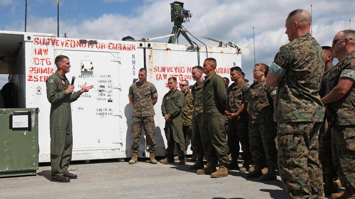 Lt. Col. Kris Faught speaks to Marines with Marine Unmanned Aerial Vehicle Squadron 2 before the first RQ-21A Blackjack flight into Class D airspace over Marine Corps Air Station Cherry Point, North Carolina, March 21, 2016. The RQ-21A Blackjack system is modular, flexible and multi-mission capable, providing roll-on, roll-off transitions between land and maritime environments. Faught is the commanding officer of VMU-2.