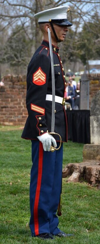 Sgt. Matthew Kies, platoon sergeant, MCB Quantico, prepares to order his rifle line of seven Marines to render a 21-gun salute.