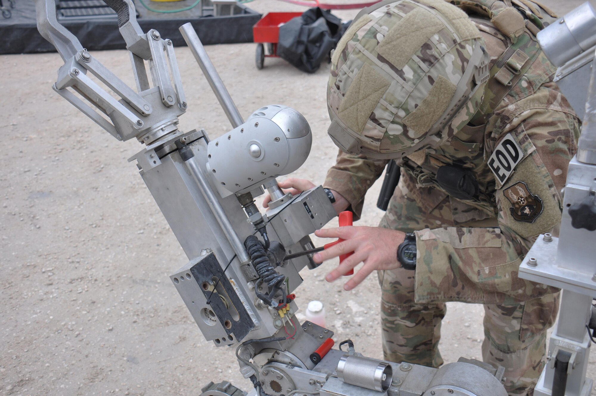Staff Sgt. Jordan Burger, 379th Expeditionary Civil Engineer Squadron explosive ordnance craftsman, preps an F-6 robot to search for mock explosives during a hazardous materials exercise at Al Udeid Air Base, Qatar March 16. The training exercise provided first responders an opportunity to practice reacting to an emergency incident. Several emergency personnel participated in the exercise including security forces and medics. (U.S. Air Force photo by Tech. Sgt. James Hodgman/Released)