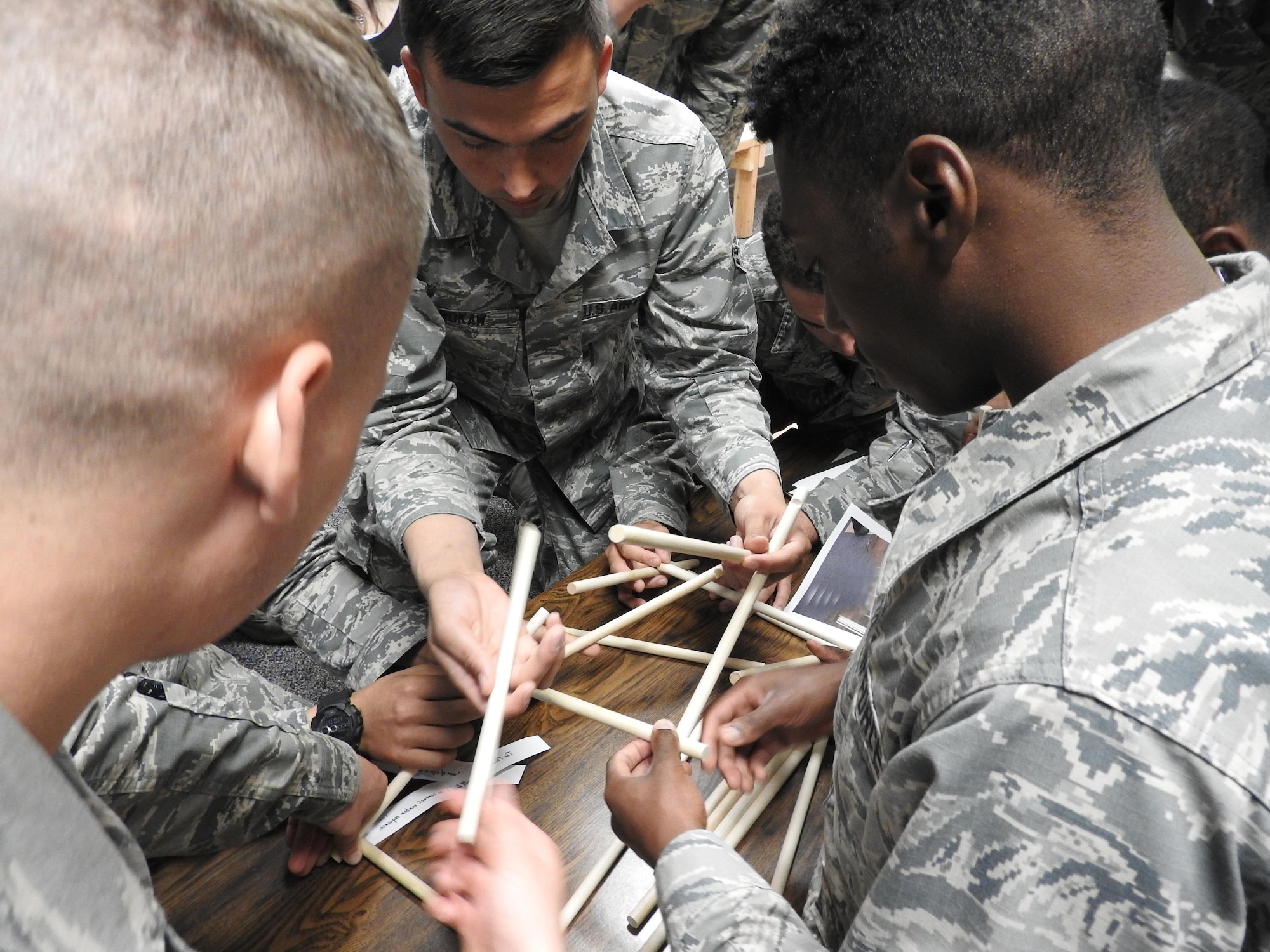 Airman 1st Class Jonathan Brokaw and other Mystery Escape Room participants work on a puzzle in the DaVinci's Secret room in Arnold Hall Community Center on Joint Base San Antonio-Lackland on March 1, 2016. Teamwork, communication and collaboration are keys to success in this team-building exercise. 
