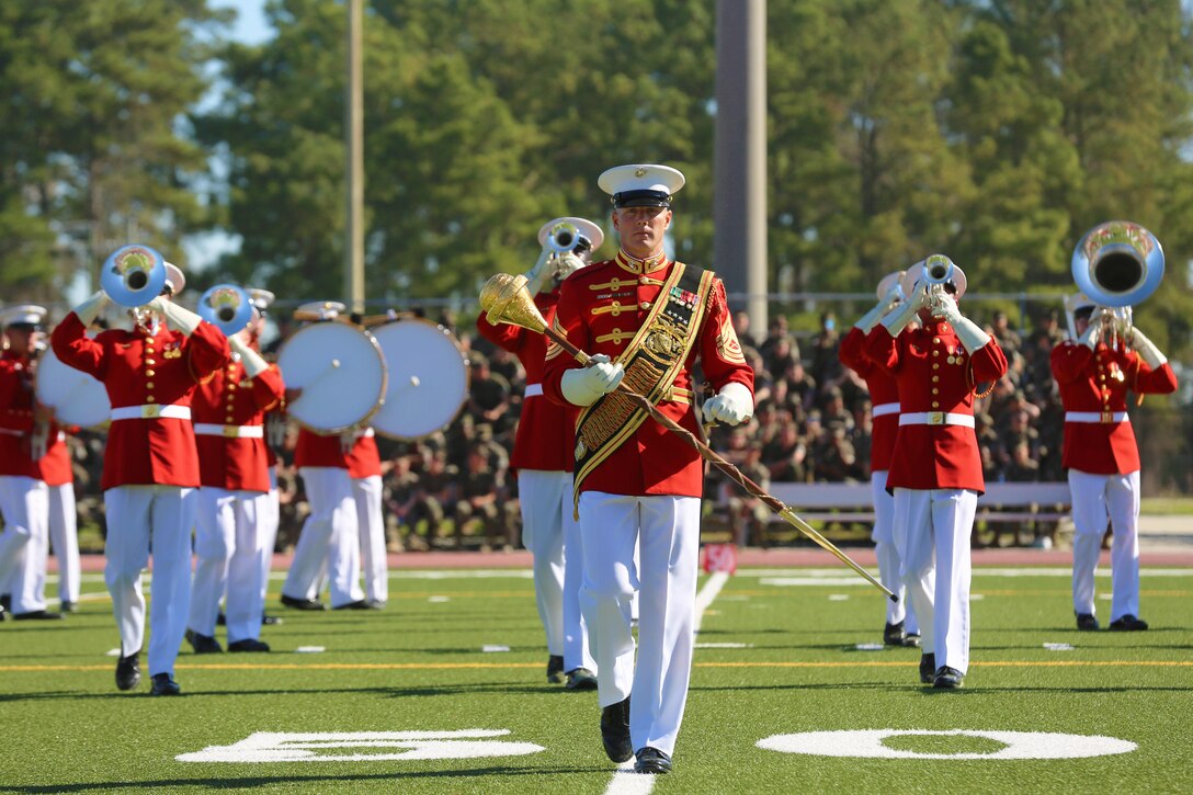 Master Sgt. Keith Martinez, the drum major for the “Commandant’s Own” Marine Corps Drum and Bugle Crops, leads his unit during the 2016 Battle Colors Ceremony, March 17 at Marine Corps Base Camp Lejeune. The Drum and Bugle Corps represents over 80 years of dedicated musicians who have served through relentless dedication to their craft and continuous practicing.