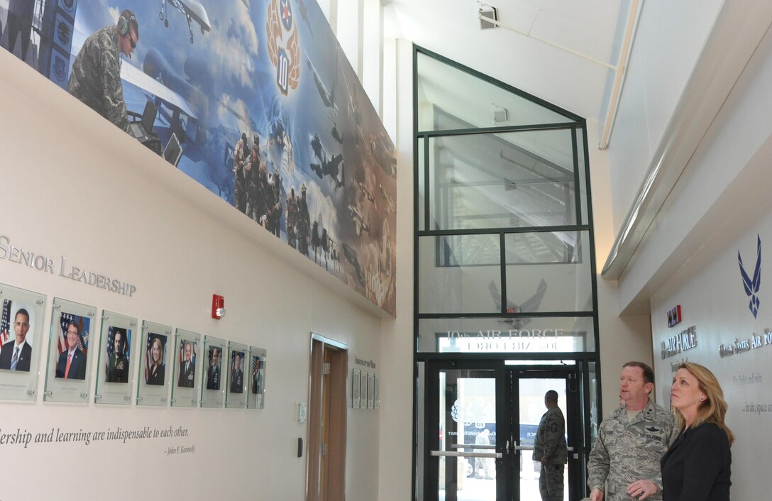 NAVAL AIR STATION FORT WORTH JOINT RESERVE BASE, Texas -- Tenth Air Force Commander Maj. Gen. Richard Scobee shows Secretary of the Air Force Deborah Lee James the mural that depicts the diverse mission and history of his numbered Air Force, March 23, 2016. During her visit, the secretary spoke with 10th Air Force and 301st Fighter Wing leadership, key spouses, Airmen and the sexual assault response coordinator. James also had the opportunity to visit with the Air National Guard’s 136th Airlift Wing. (U.S. Air Force photo/Staff Sgt. Melissa Harvey)