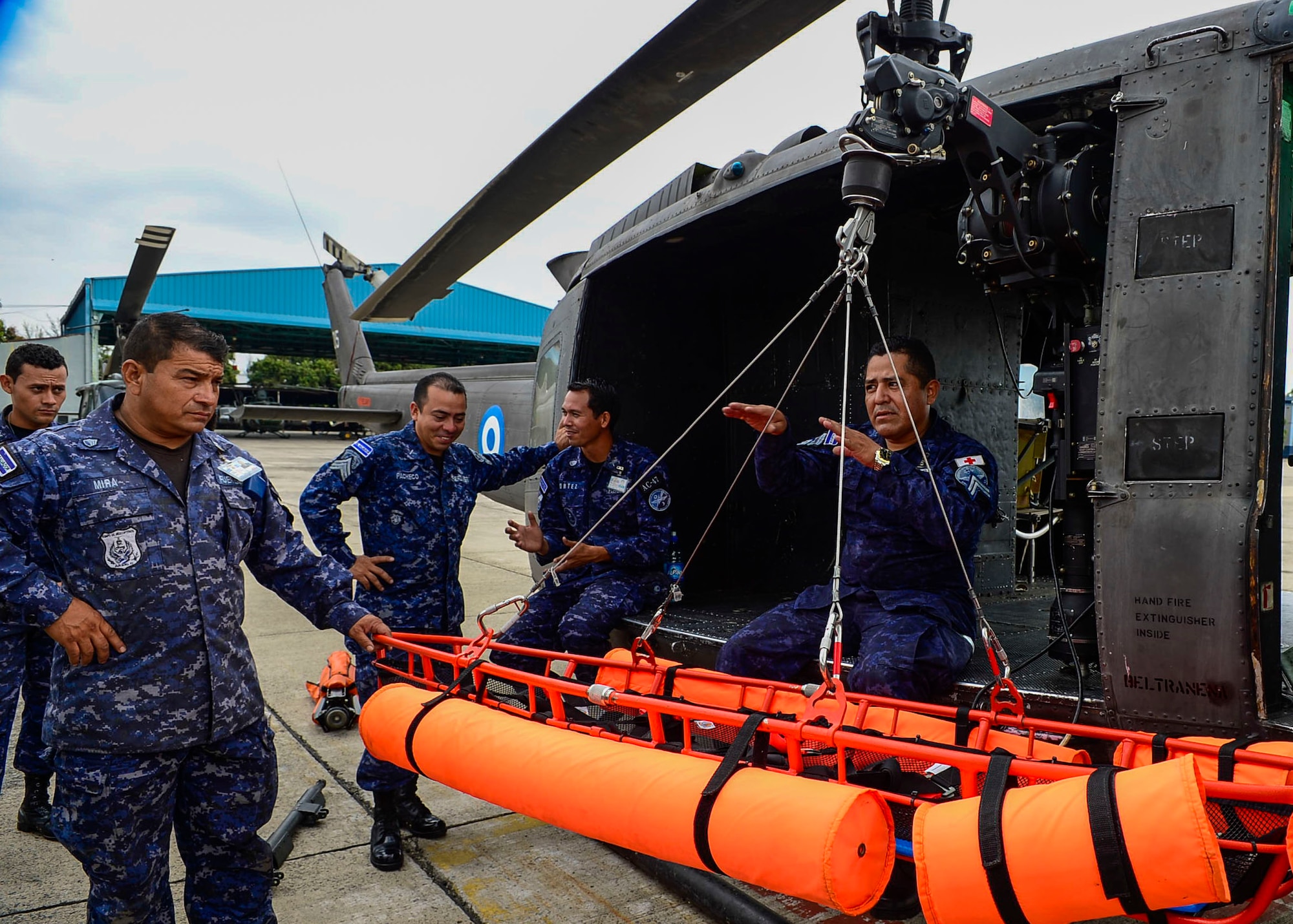 Members from the Salvadoran air demonstrate the use of and extractor and floating litter during a U.S. Air Force and Salvadoran air force subject matter expert exchange at Ilopango Air Base, El Salvador, March 8, 2016. 12th Air Force (Air Forces Southern) surgeon general’s office, led a five member team of medics from around the U.S. Air Force on a week-long medical subject matter expert exchange in El Salvador. (U.S. Air Force photo by Tech. Sgt. Heather R. Redman/Released)