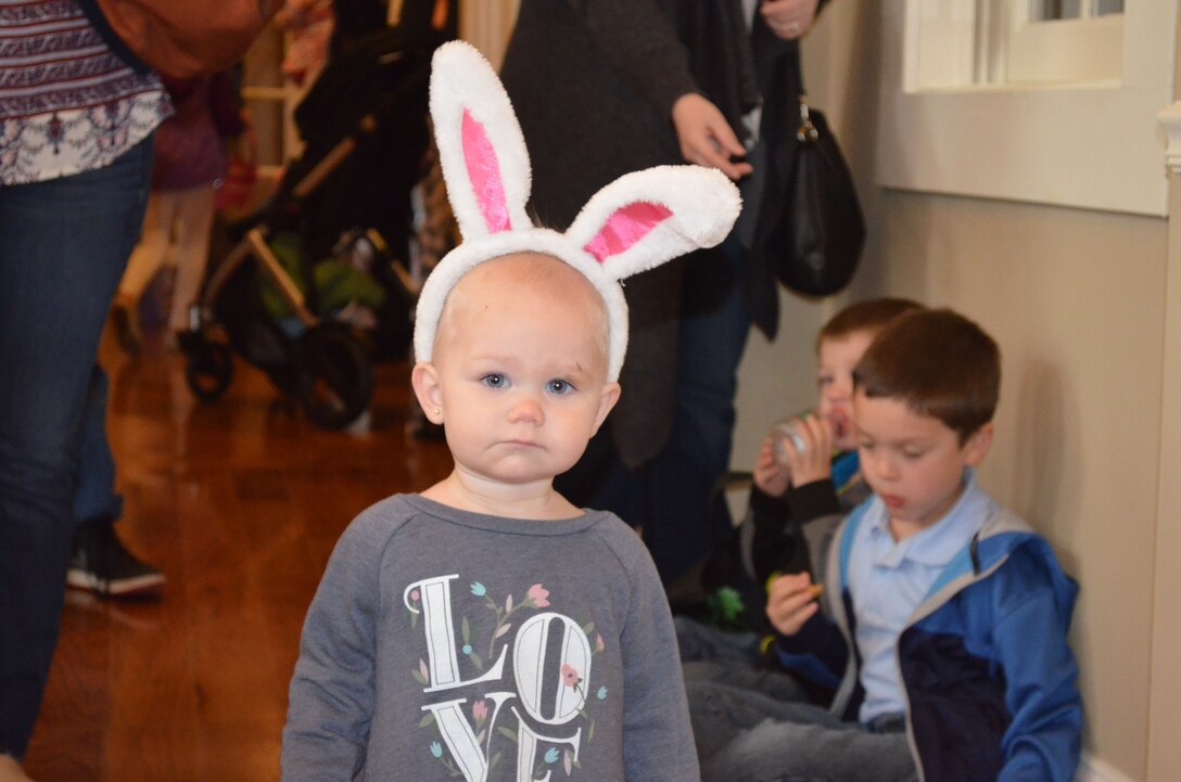 MARINE CORPS BASE QUANTICO, Va. — Emily, 1, waits inside the Lincoln Military Housing office for the Easter Egg Hunt to start. 