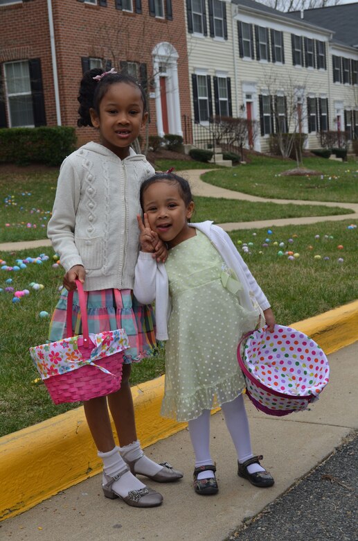MARINE CORPS BASE QUANTICO, Va. — Miyana, 6, and Aila, 3, show off their Easter dresses as they wait for the Marine Corps Base Quantico Easter Egg Hunt to begin. 