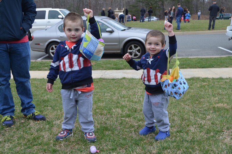 MARINE CORPS BASE QUANTICO, Va. — Captain America fans and brothers Anthony, 3, and Nicholas, 2, show off their Easter baskets during the Marine Corps Base Quantico Easter Egg Hunt held Saturday in the yard at the Lincoln Military Housing office. 