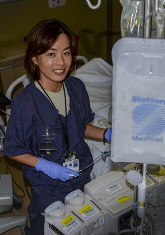 Capt. Min Choi, 99th Inpatient Operation Squadron clinical nurse in the critical care unit, prepares an IV bag at the Mike O’Callaghan Federal Medical Center at Nellis Air Force Base, Nev., March 17, 2016. Critical care nurses must be proficient in a wide variety of high-level nursing skills. They need to be experts in evaluating intensive care patients, administering care, recognizing complications and coordinating with other members of the critical care team. (U.S. Air Force photo by Airman 1st Class Nathan Byrnes)