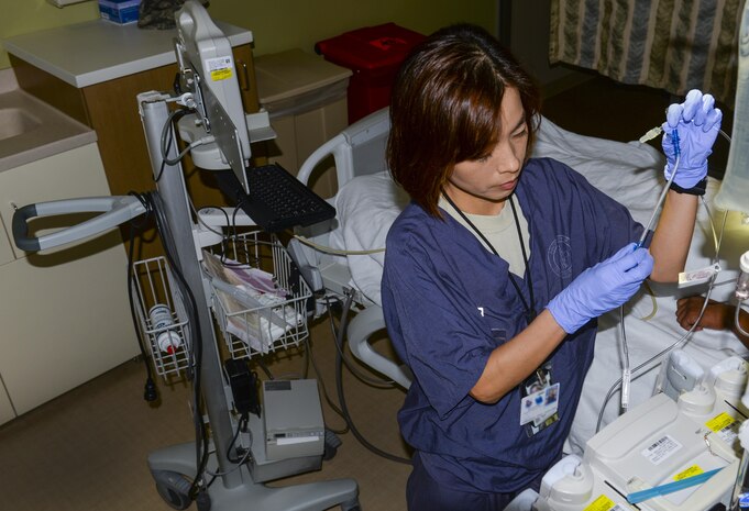 Capt. Min Choi, 99th Inpatient Operation Squadron clinical nurse in the critical care unit, prepares an IV bag at the Mike O’Callaghan Federal Medical Center at Nellis Air Force Base, Nev., March 17, 2016. Critical care nurses must be proficient in a wide variety of high-level nursing skills. They need to be experts in evaluating intensive care patients, administering care, recognizing complications and coordinating with other members of the critical care team. (U.S. Air Force photo by Airman 1st Class Nathan Byrnes)