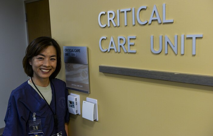 Capt. Min Choi, 99th Inpatient Operation Squadron clinical nurse in the critical care unit, poses in front of the critical care unit sign at the Mike O’Callaghan Federal Medical Center at Nellis Air Force Base, Nev., March 17, 2016. Critical care nursing is a complex and challenging nurse specialty to which many registered nurses aspire. Also known as intensive care unit nurses, critical care nurses use their advanced skills to care for patients who are at high risk for life-threatening health problems.