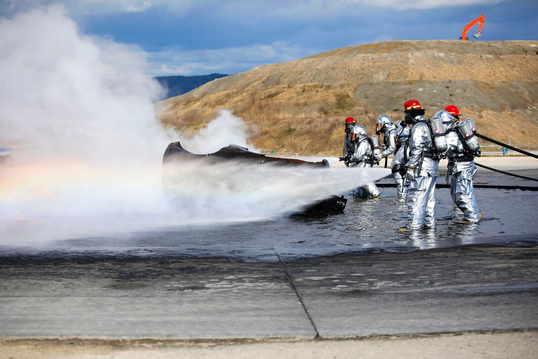 Marines conduct firefighting training to sharpen their skills at Marine Corps Air Station Iwakuni, Japan, March 11, 2016. Marine Corps photo by Lance Cpl. Jacob A. Farbo
