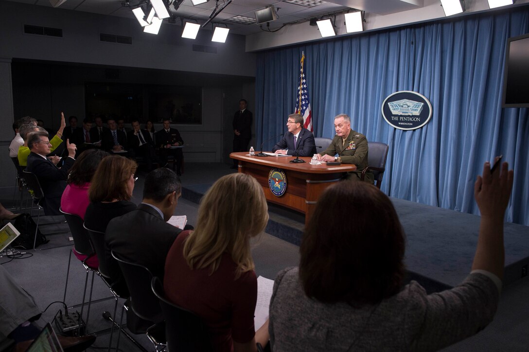 Defense Secretary Ash Carter and Marine Corps Gen. Joe Dunford, chairman of the Joint Chiefs of Staff, take questions from reporters during a news conference at the Pentagon, March 25, 2016. DoD photo by Navy Petty Officer 1st Class Tim D. Godbee