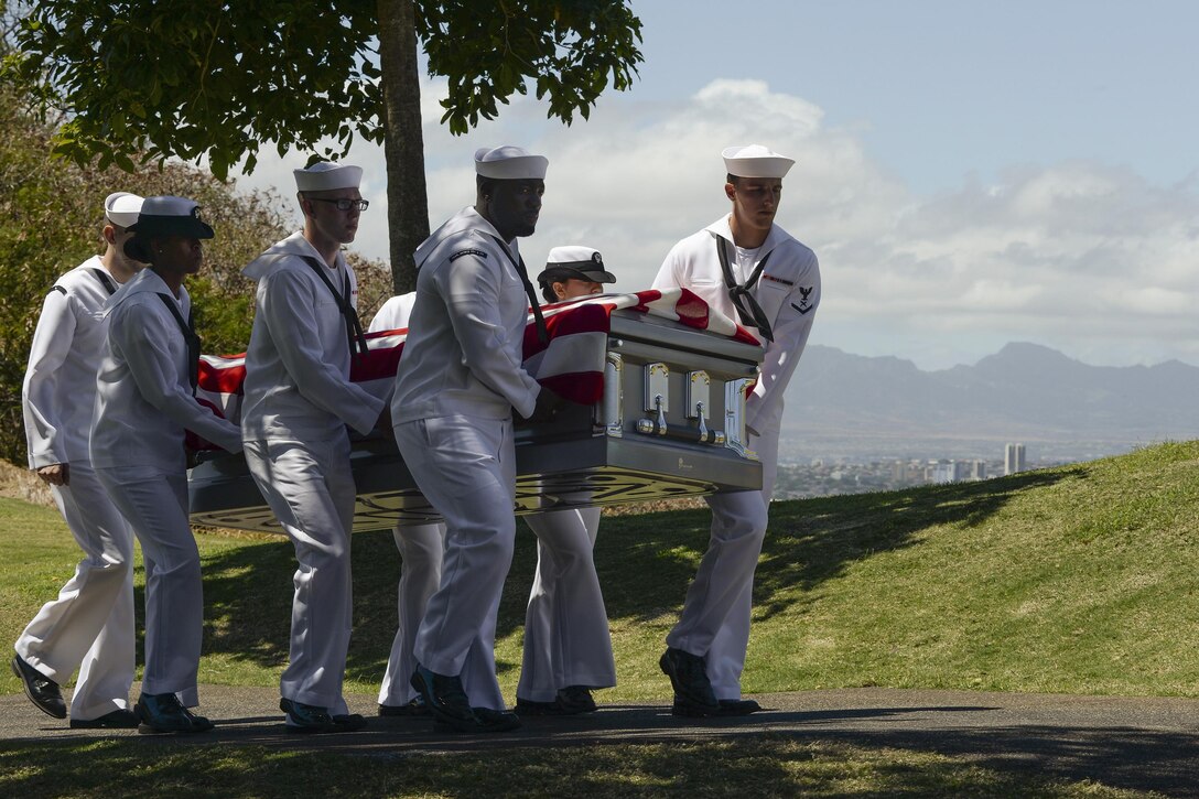 Sailors carry the remains of Navy Ensign Lewis Stockdale, who was killed during the attack on Pearl Harbor, during a reinterment ceremony at the National Memorial Cemetery of the Pacific, commonly known as the Punchbowl, in Honolulu, March 18, 2016. Stockdale’s remains were recently identified and he was buried with full military honors. The sailors are assigned to Joint Base Pearl Harbor-Hickam's honors and ceremonies organization. Navy photo by Petty Officer 2nd Class Laurie Dexter