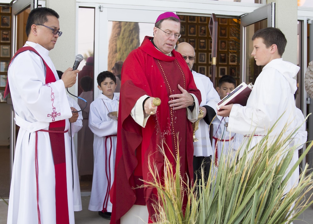 Bishop Neal J. Buckon, Military Archdiocese Vicar for the Western Region, blesses palm leaves during Palm Sunday mass, at the Combat Center’s Catholic Chapel, March 20, 2016. (Official Marine Corps photo by Cpl. Connor Hancock/Released)