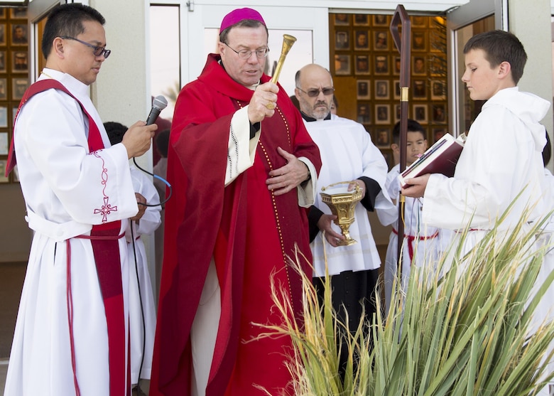 Bishop Neal J. Buckon, Military Archdiocese Vicar for the Western Region, blesses palm leaves during Palm Sunday mass, at the Combat Center’s Catholic Chapel, March 20, 2016. (Official Marine Corps photo by Cpl. Connor Hancock/Released)