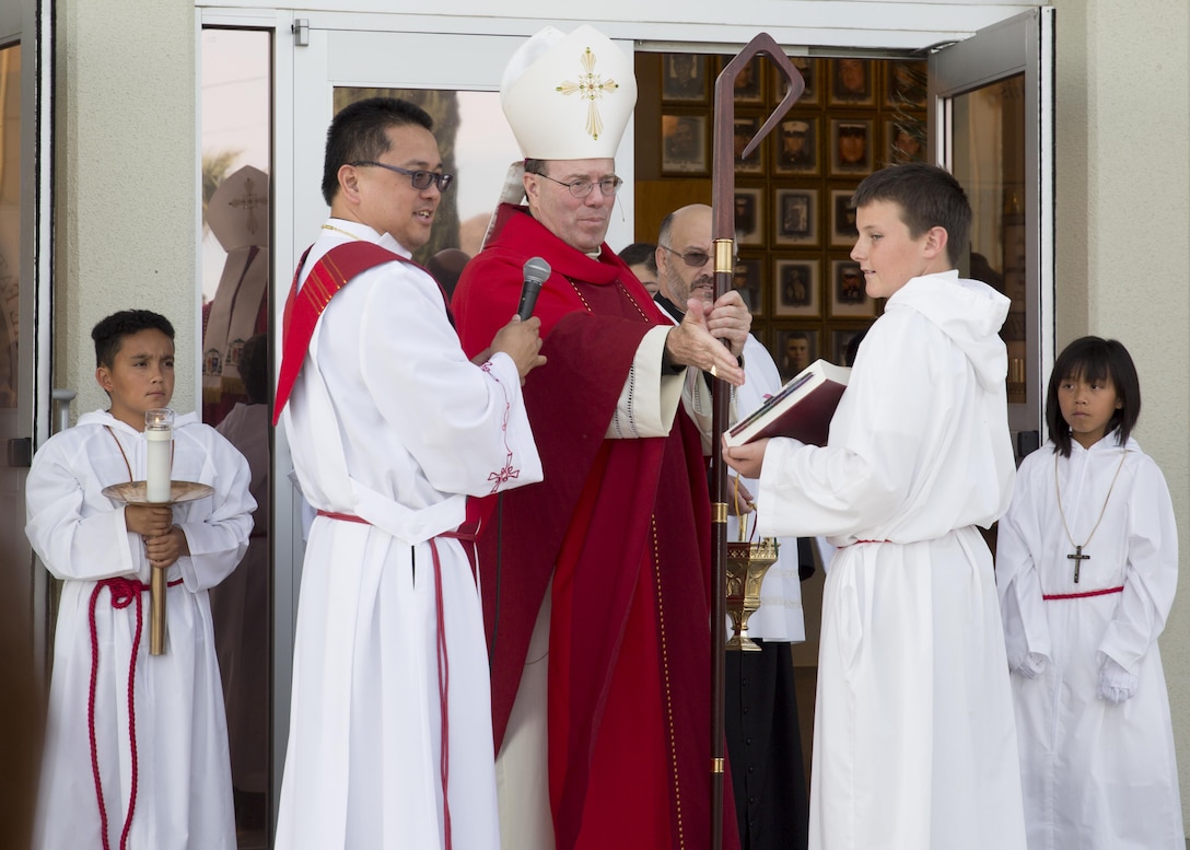 Bishop Neal J. Buckon, Military Archdiocese Vicar for the Western Region, begins Palm Sunday mass at the Combat Center’s Catholic Chapel, March 20, 2016. (Official Marine Corps photo by Cpl. Connor Hancock/Released)