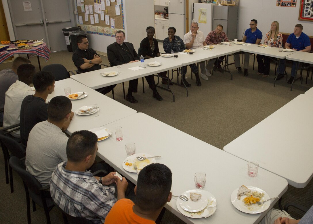 Bishop Neal J. Buckon, Military Archdiocese Vicar for the Western Region, speaks to Marines, sailors and church members during a pastoral visit at the Combat Center’s Catholic Chapel, March 19, 2016. (Official Marine Corps photo by Cpl. Connor Hancock/Released)
