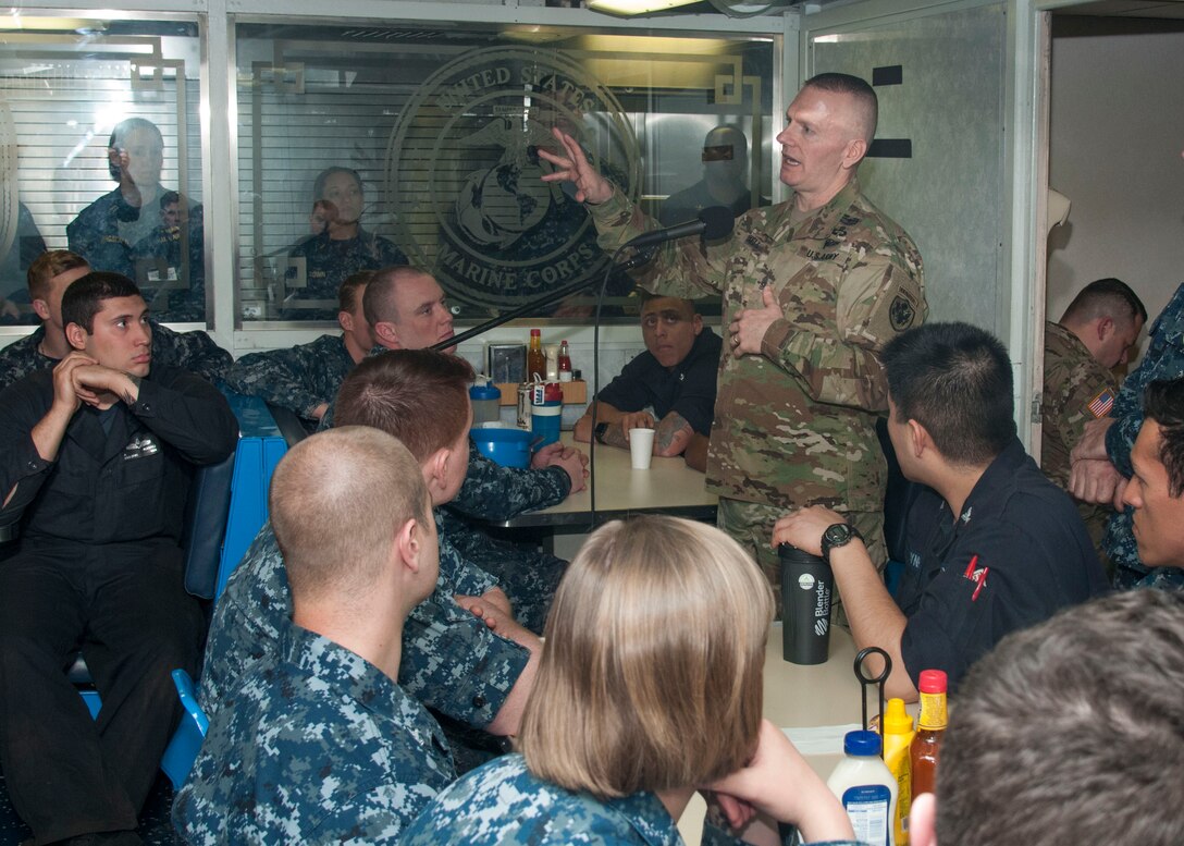 Army Command Sgt. Maj. John W. Troxell, the Senior Enlisted Advisor to the Chairman of the Joint Chiefs of Staff, addresses the crew of the amphibious dock landing ship USS Gunston Hall during an all-hands call in Portsmouth, Va., March 23, 2016. Troxell visited the Gunston Hall to highlight the chairman's priorities that include restoring joint readiness, improving joint warfighting and developing leaders. Navy photo by Petty Officer 1st Class Thomas Gagnier