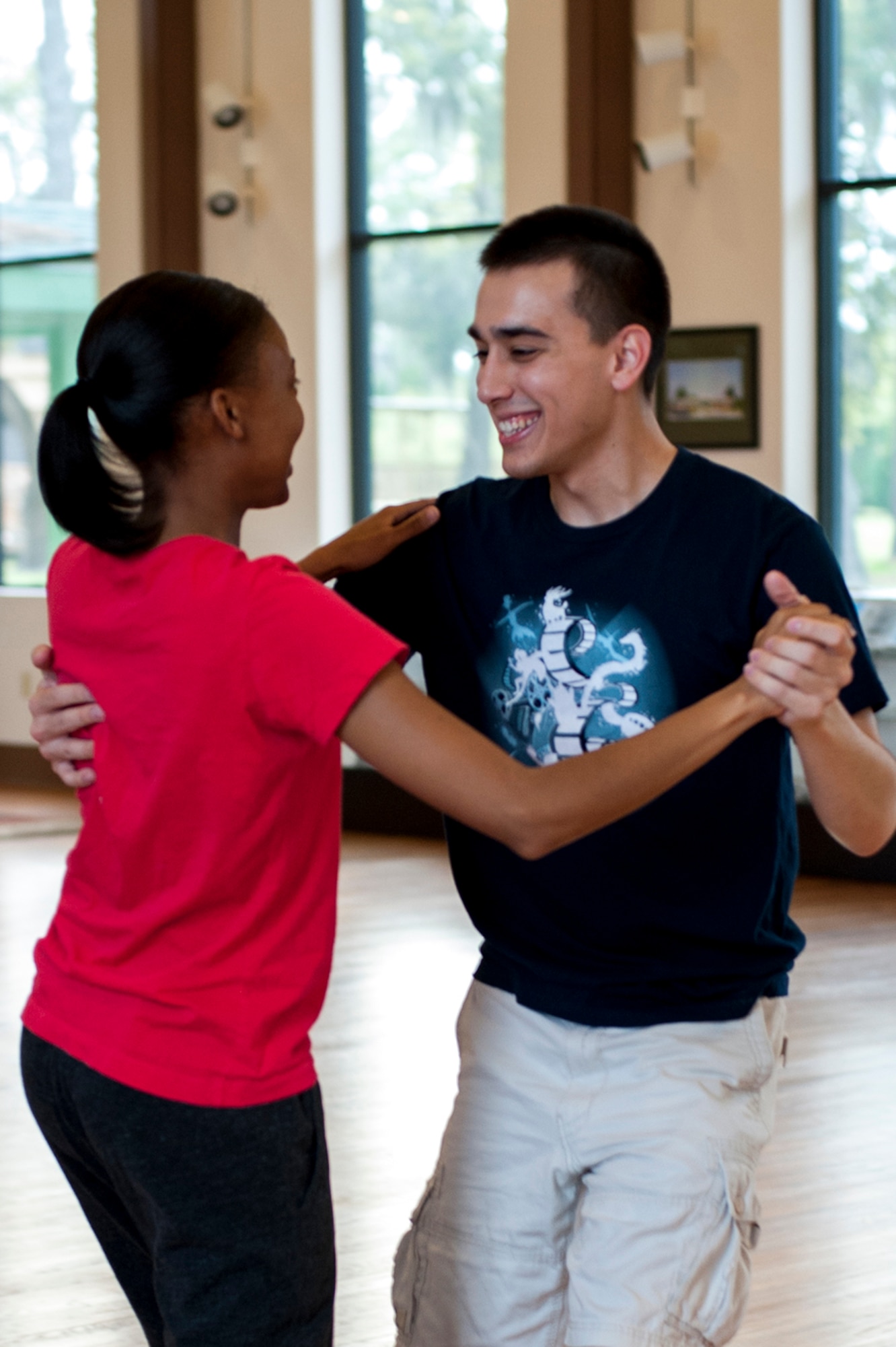 U.S. Air Force 2nd Lt. Simon Pena, 23d Force Support Squadron lodging officer, teaches Senior Airman Candice Bates, 23d Aerospace Medicine Squadron dental assistant, proper techniques during a ballroom dance class, March 24, 2016, at Moody Air Force Base, Ga. Pena uses his experience in nearly 20 different styles of dance to teach Moody Airmen and their families. (U.S. Air Force photo by Airman 1st Class Lauren M. Johnson/Released)