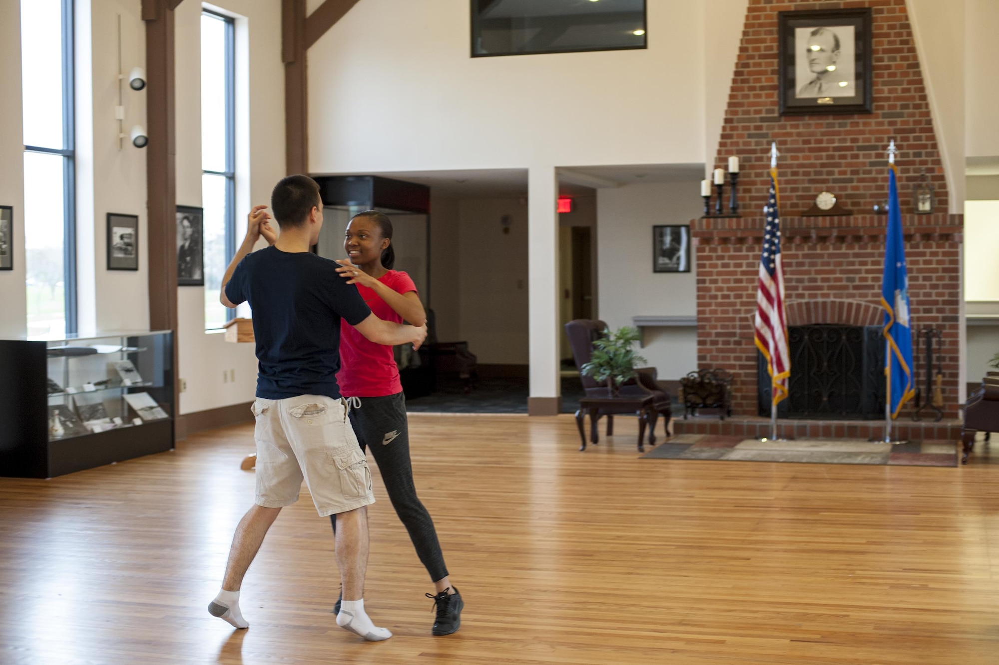 U.S. Air Force 2nd Lt. Simon Pena, 23d Force Support Squadron lodging officer, dances with Senior Airman Candice Bates, 23d Aerospace Medicine Squadron dental assistant, during a ballroom dance class, March 24, 2016, at Moody Air Force Base, Ga. During the lesson, Pena taught Bates how to perform the waltz and tango. (U.S. Air Force photo by Airman 1st Class Lauren M. Johnson/Released)