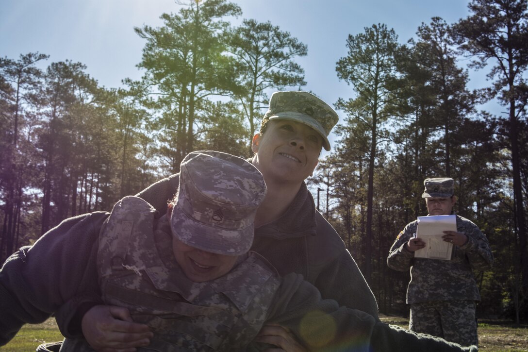 Staff Sgt. Jessica Niedzwecki representing 4th Bde., 98th Training Division (IET), struggles to pull an injured Soldier to safety during the medical tasks station at the 2016 108th Training Command (IET) Best Warrior Competition held at Fort Jackson, S.C., March 21. This year's Best Warrior competition will determine the top noncommissioned officer and junior enlisted Soldier who will represent the 108th Training Command (IET) in the Army Reserve Best Warrior competition later this year at Fort Bragg, N.C. (U.S. Army photo by Sgt. 1st Class Brian Hamilton/released)