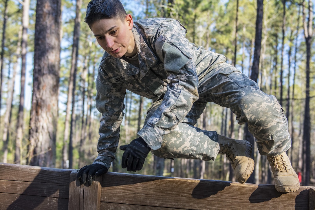 Staff Sgt. Beth Juliar, representing 4th Bde., 98th Training Division (IET), hurdles the low wall at the endurance obstacle course during the 2016 108th Training Command (IET) Best Warrior Competition held at Fort Jackson, S.C., March 23. This year's Best Warrior competition will determine the top noncommissioned officer and junior enlisted Soldier who will represent the 108th Training Command (IET) in the Army Reserve Best Warrior competition later this year at Fort Bragg, N.C. (U.S. Army photo by Sgt. 1st Class Brian Hamilton/released)