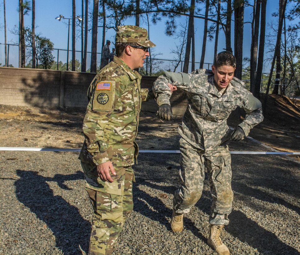 Staff Sgt. Beth Juliar, representing 4th Bde., 98th Training Division (IET), is helped to her feet after completing the endurance obstacle course during the 2016 108th Training Command (IET) Best Warrior Competition held at Fort Jackson, S.C., March 23. This year's Best Warrior competition will determine the top noncommissioned officer and junior enlisted Soldier who will represent the 108th Training Command (IET) in the Army Reserve Best Warrior competition later this year at Fort Bragg, N.C. (U.S. Army photo by Sgt. 1st Class Brian Hamilton/released)