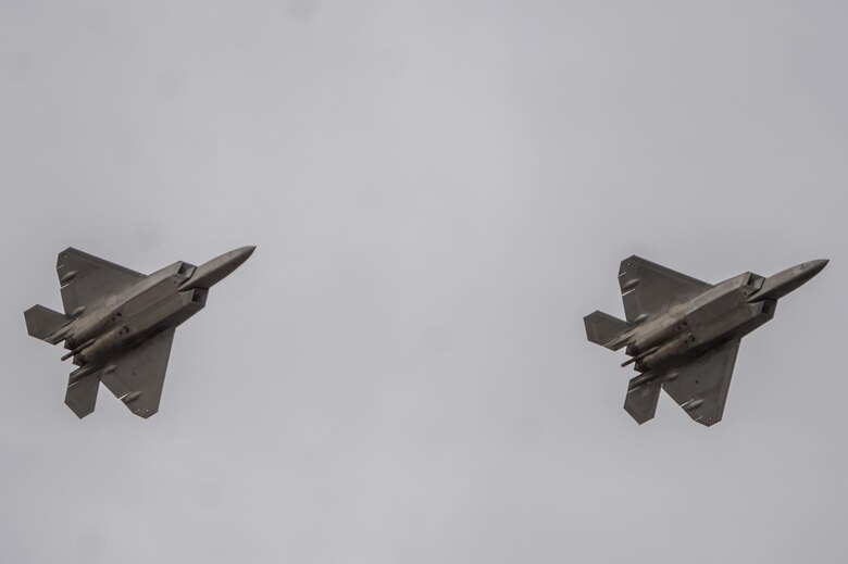 Two U.S. Air Force F-22 Raptors prepare to land on Joint Base Elmendorf-Richardson after a training sortie, March 24, 2016. Training sorties are imperative to pilot development and overall mission effectiveness. (U.S. Air Force photo by Senior Airman James Richardson/Released)