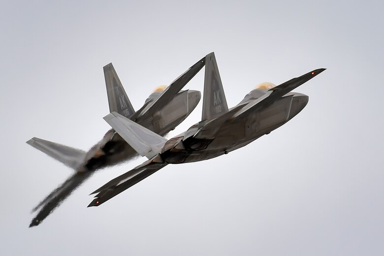 Two F-22 Raptors from Joint Base Elmendorf-Richardson, Alaska’s 3rd Wing conduct approach training, Thursday, March 24, 2016.  The F-22 is the U.S. Air Force’s premium fifth-generation fighter asset.  (U.S. Air Force photo/Justin Connaher)