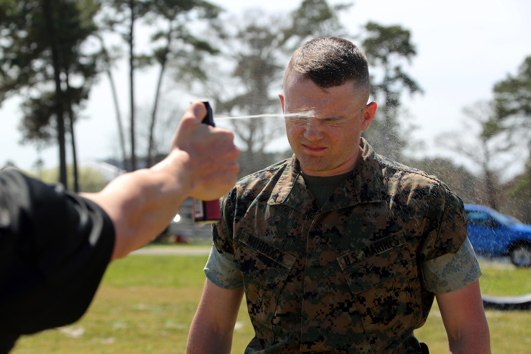 Lance Cpl. Brandon Murdock is exposed to OC spray during non-lethal weapons training at Marine Corps Air Station Cherry Point, N.C., March 17, 2016. Twelve Marines from various units participated in the training event with the Provost Marshal‘s Office. Marines were sprayed in the face with the potent substance and then maneuvered through an obstacle course simulating non-compliant threats. The training familiarized the participants with both the gear they will carry and the effects it will have on an individual being sprayed. Murdock is an avionics technician with Marine Aviation Logistics Squadron 14. (U.S. Marine Corps photo by Cpl. N.W. Huertas/Released)
