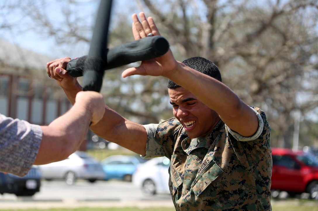 Lance Cpl. Xavier Tunstall participates in an obstacle course during non-lethal weapons training at Marine Corps Air Station Cherry Point, N.C., March 17, 2016. Twelve Marines from various units participated in the training event with the Provost Marshal‘s Office. Marines were sprayed in the face with the potent substance and then maneuvered through an obstacle course simulating non-compliant threats. The training familiarized the participants with both the gear they will carry and the effects it will have on an individual being sprayed. Tunstall is an administrative clerk with Headquarters and Headquarters Squadron. (U.S. Marine Corps photo by Cpl. N.W. Huertas/Released)