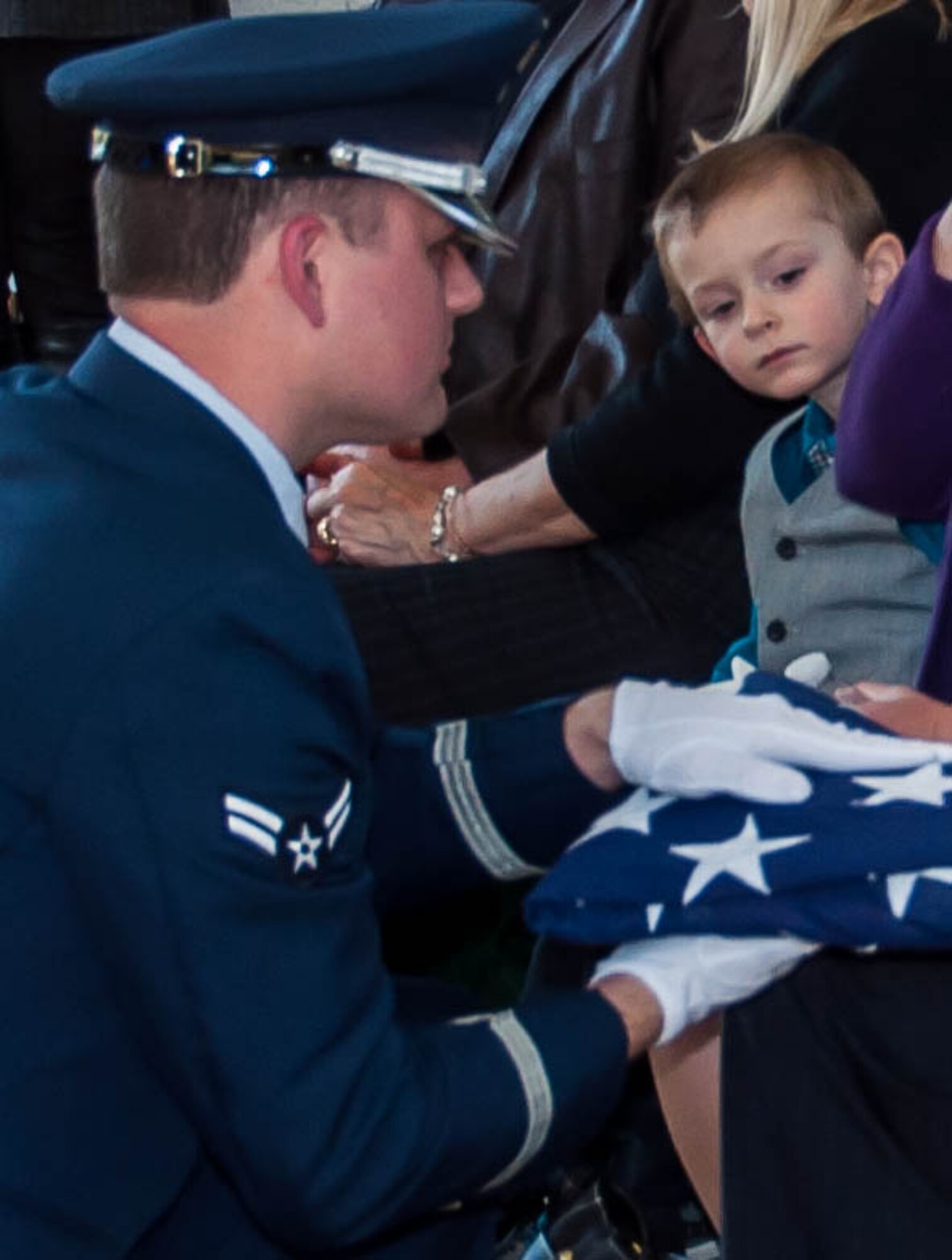 A member of the Barksdale Air Force Base Honor Guard presents an American flag to Rick Wehling and his family during the funeral service for his father, Retired Chief Master Sgt. Layton Wehling on March 22, 2016 at Hillcrest Cemetery in Bossier City, La. Wehling’s service spanned over sixty years and his final days were working as a civilian with the 307th Bomb Wing, Barksdale Air Force Base, La. (U.S. Air Force photo by Master Sgt. Laura Siebert/Released)