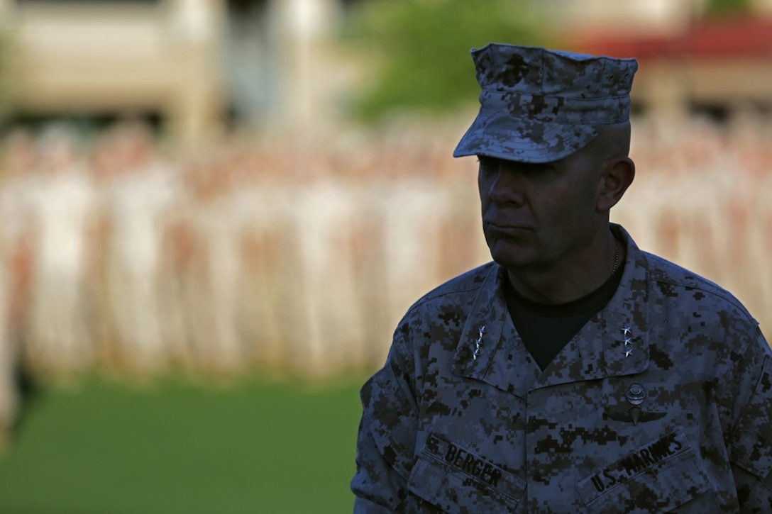 Lieutenant General David H. Berger, commanding general, I Marine Expeditionary Force, walks away after presenting the Marine Corps Motor Transportation Unit of the Year award to Marines assigned to Truck Company, Headquarters Battalion, 1st Marine Division, aboard Marine Corps Base Camp Pendleton, March 25, 2016. The Marines with Truck Co. demonstrated exceptional technical and tactical proficiency and dependability which earned them the award.