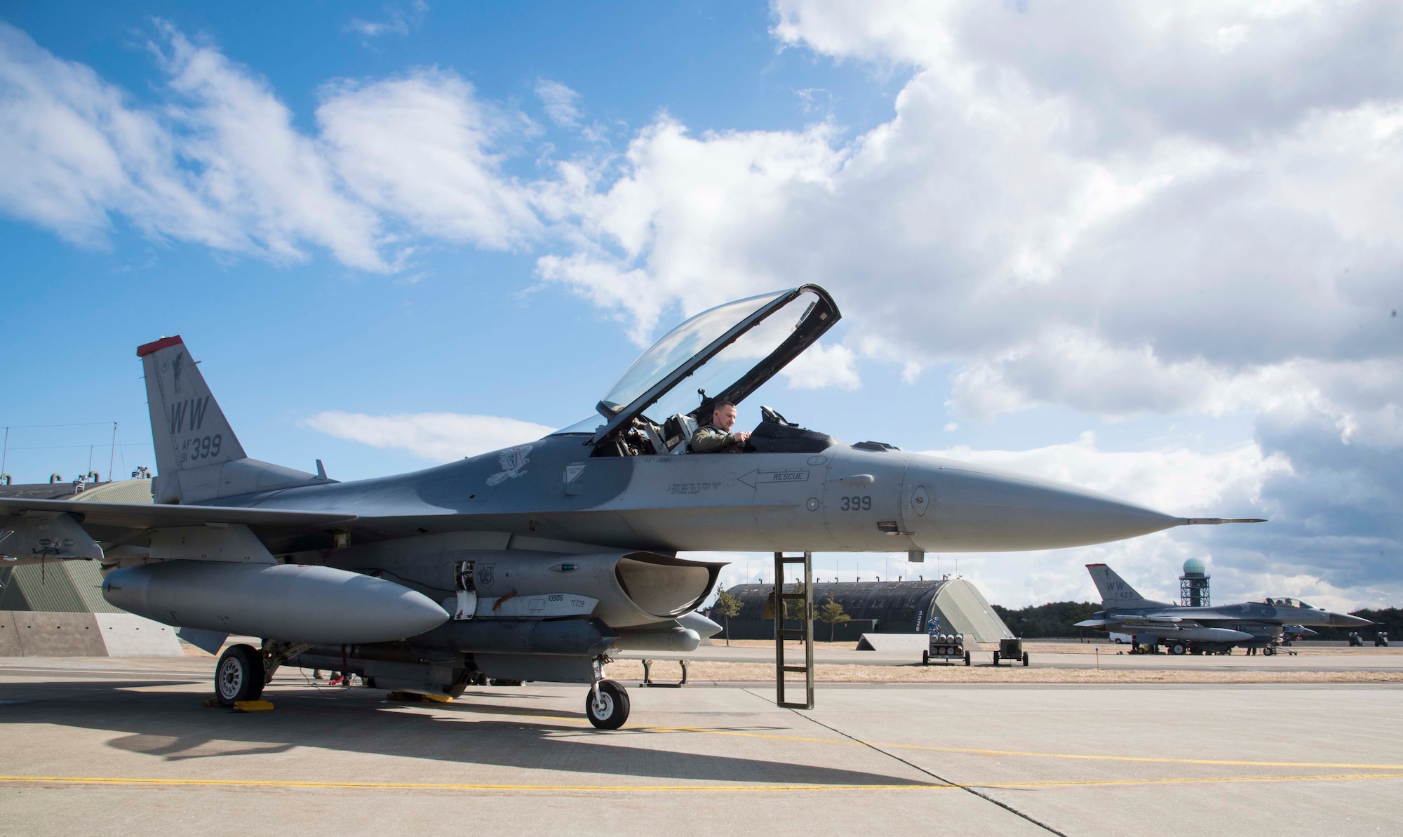 U.S. Air Force Lt. Col. Paul Miller, the deputy commander of the 35th Operations Group, prepares an F-16 Fighting Falcon for flight during exercise Beverly Sunrise 16-03 at Misawa Air Base, Japan, March 23, 2016. The 35th Fighter Wing’s mission is the suppression of enemy air defenses, which focuses on the neutralization of enemy surface-to-air missile sites. (U.S. Air Force photo by Airman 1st Class Jordyn Fetter)