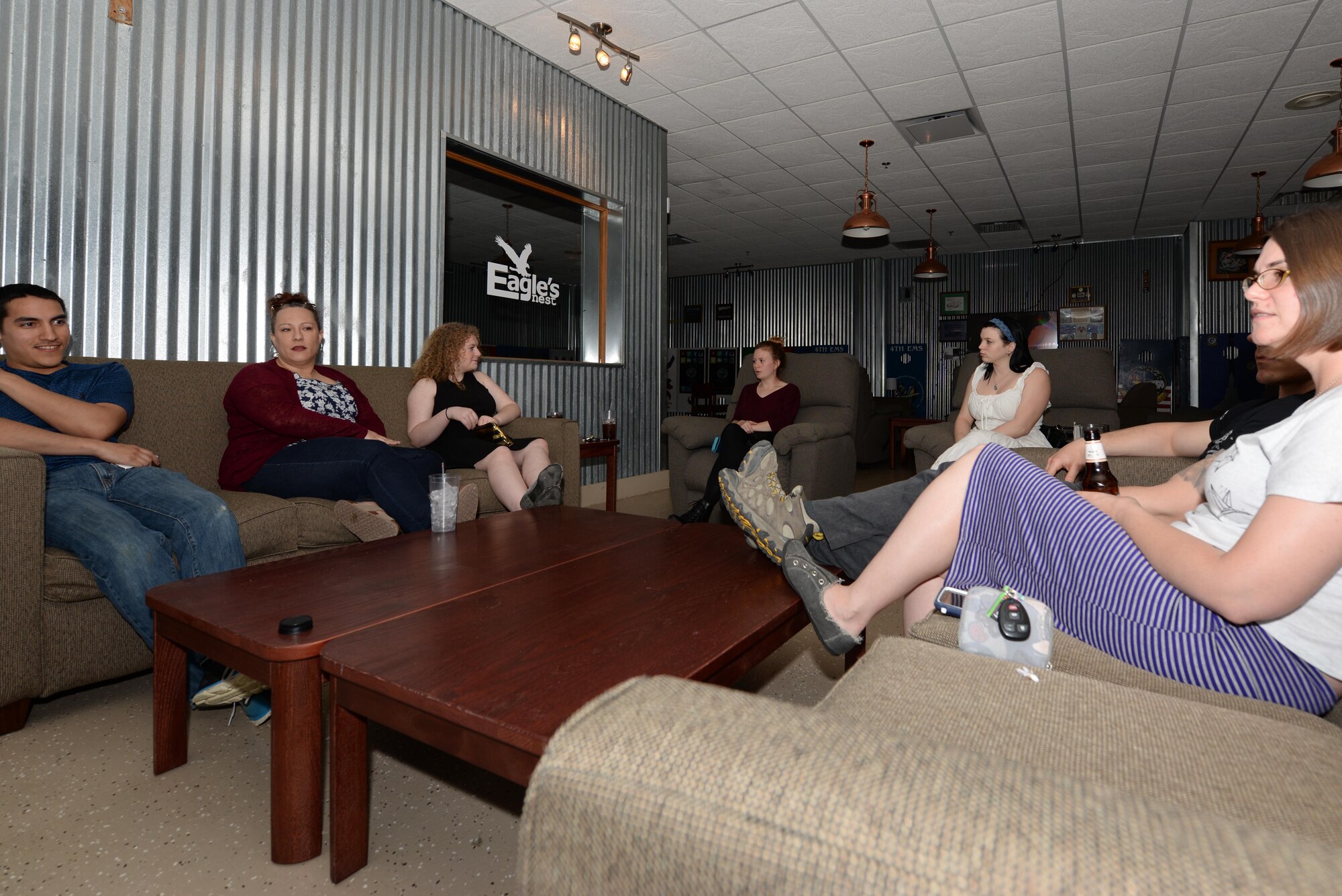 The Make it Better members discuss books and authors, March 18, 2016, inside the Eagles Nest Lounge at Seymour Johnson Air Force Base, North Carolina. The Book Club meets and talks about books in a relaxed environment every third Wednesday at noon in the base library and every third Friday at the Eagles Nest. (U.S. Air Force photo/Airman 1st Class Ashley Williamson)